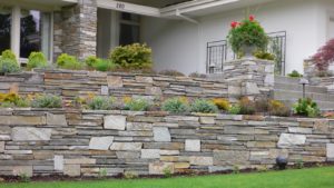 Terraced retaining wall featuring mica ledgestone